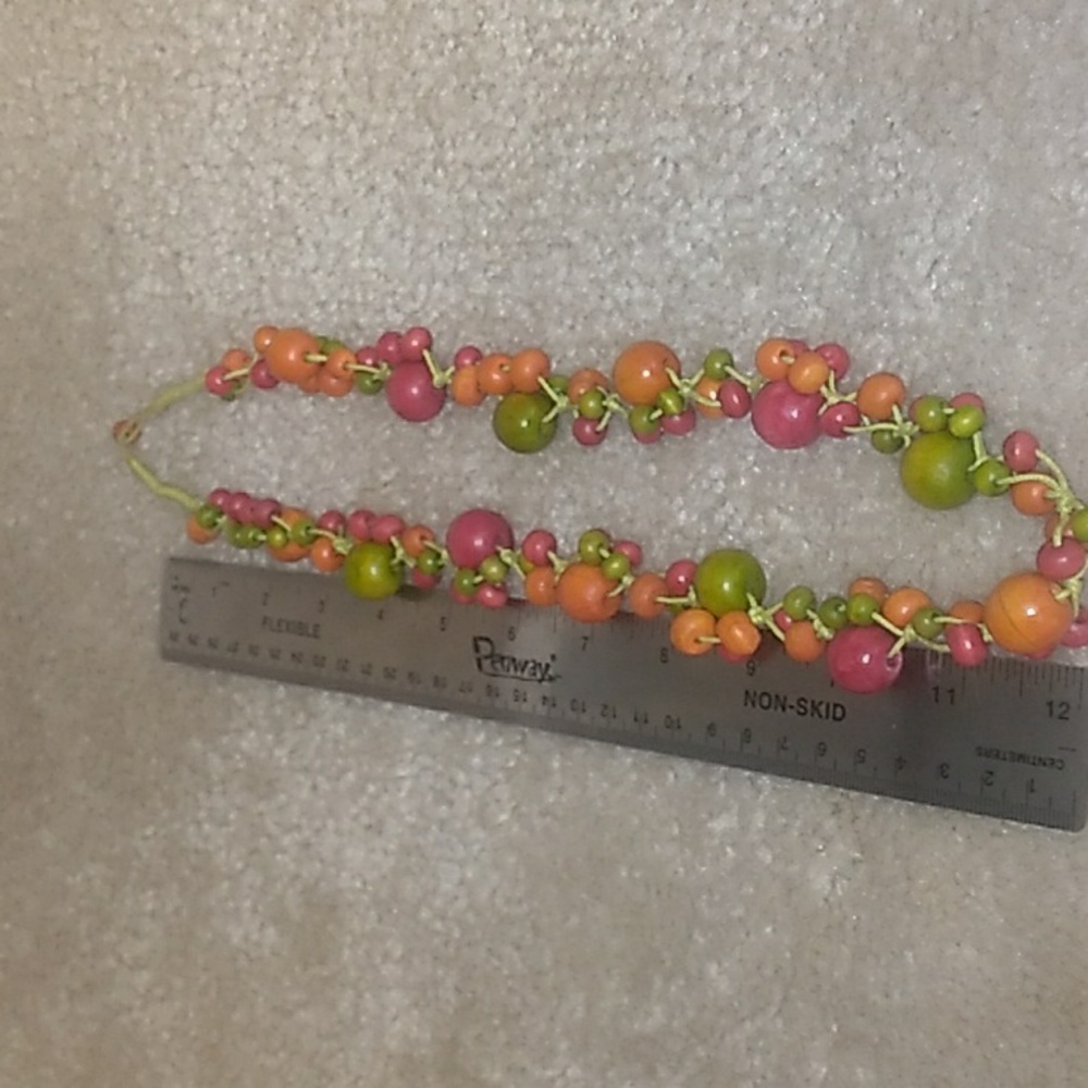 A BERRY FRUIT, LONG.  NECKLACE. MADE FROM WOOD. APPROX 24" SB.20